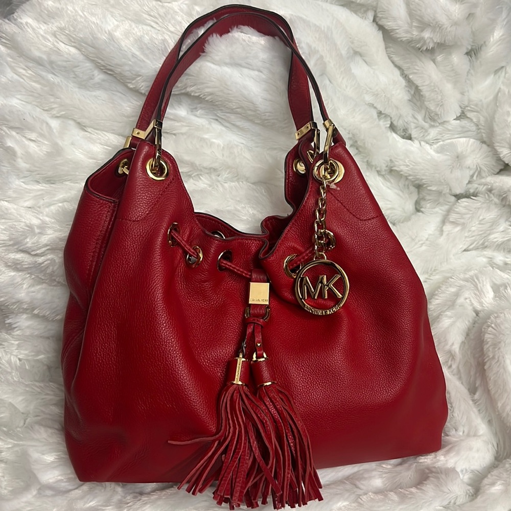 Red Michael Kors tote.